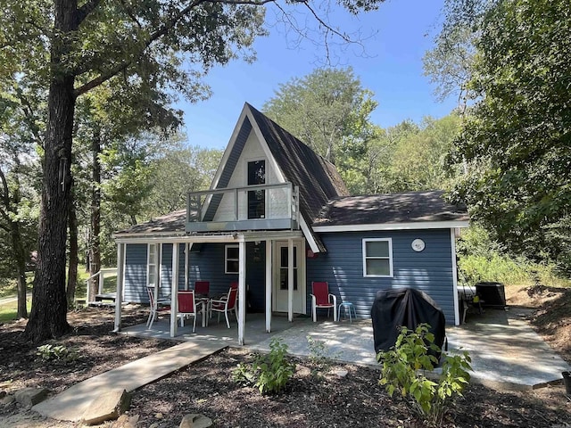 rear view of house with a patio