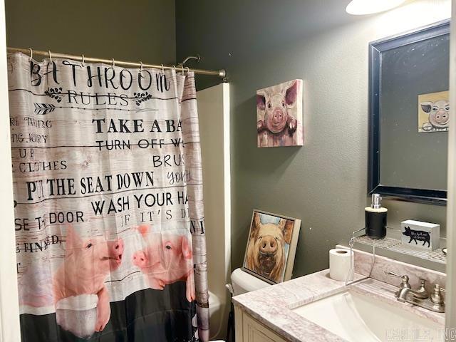 1334 Sutterfield Rd, Fox, AR 72051 - bathroom featuring vanity, a shower with curtain, and toilet