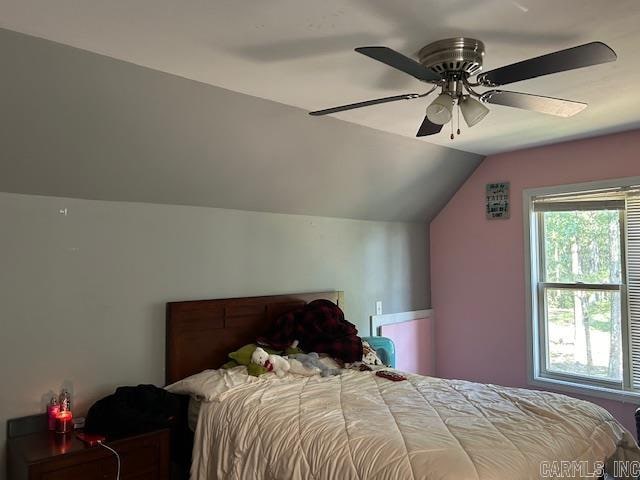 bedroom featuring ceiling fan and vaulted ceiling