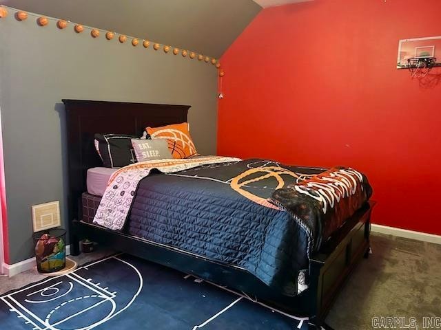 carpeted bedroom with vaulted ceiling