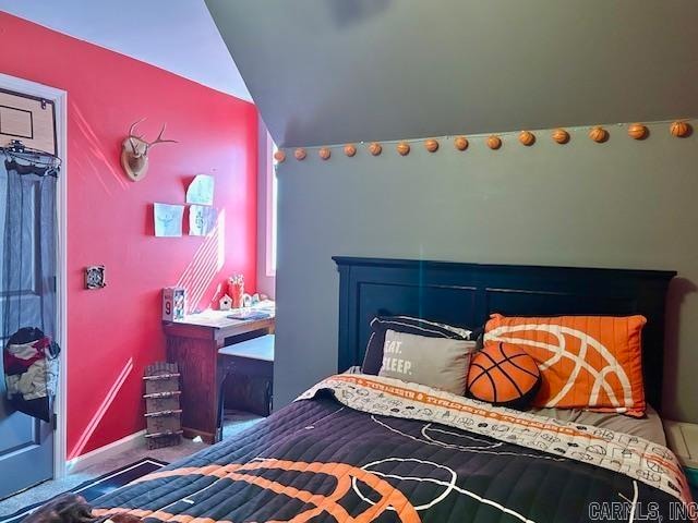 bedroom with vaulted ceiling