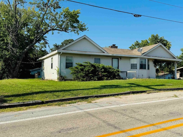 ranch-style house with a front lawn