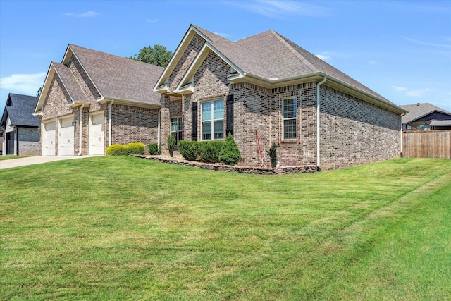 view of front of house featuring a garage and a front yard