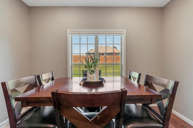 dining area with hardwood / wood-style flooring