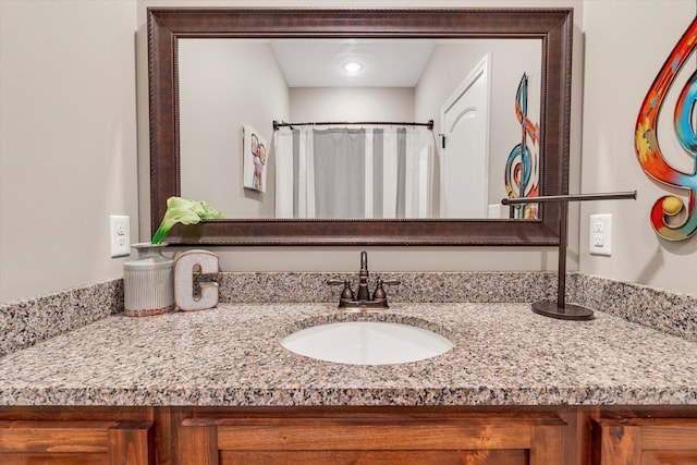 bathroom with vanity and a shower with shower curtain