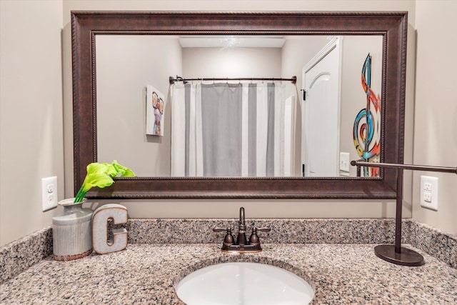 bathroom with vanity and walk in shower