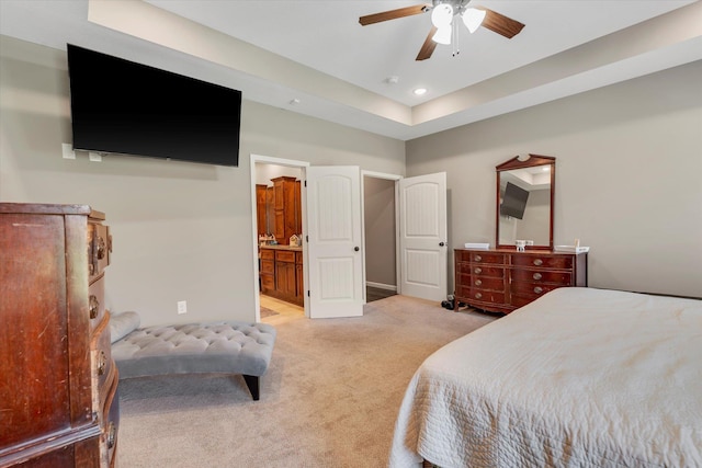 carpeted bedroom featuring ensuite bathroom and ceiling fan