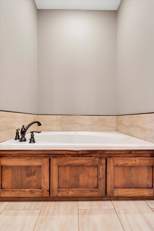 bathroom with a tub to relax in