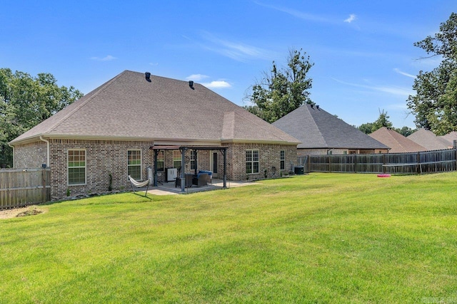 back of house with a patio, central AC unit, and a lawn