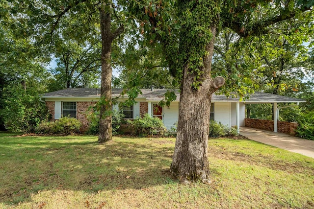 ranch-style home with a front lawn and a carport