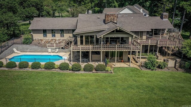 ranch-style home with a garage and a front lawn