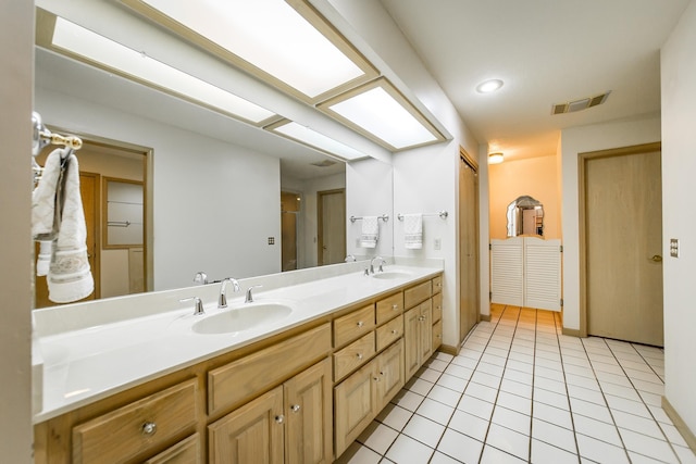 bathroom with vanity and tile patterned floors