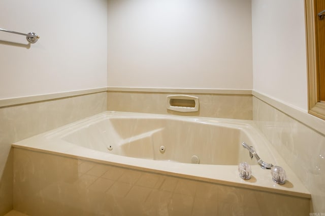 bathroom featuring a relaxing tiled tub