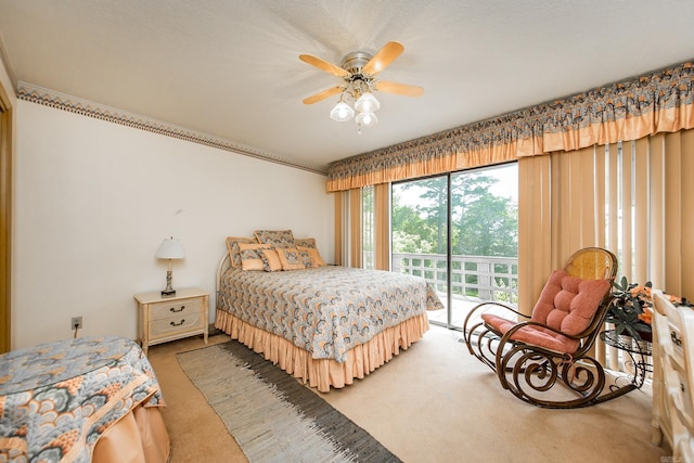 bedroom with ceiling fan, carpet floors, and access to outside