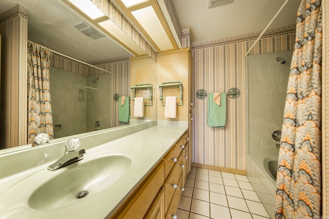 bathroom featuring vanity, tile patterned floors, and shower / bath combo with shower curtain