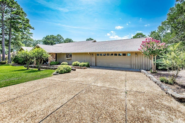 single story home with a garage and a front yard