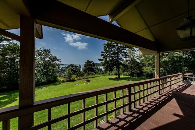 wooden terrace with a yard