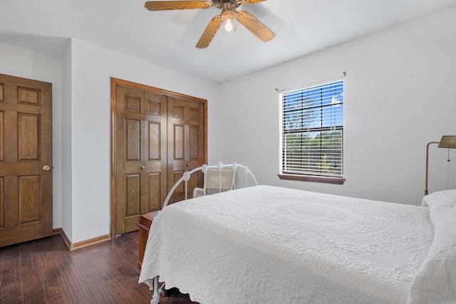 bedroom with dark hardwood / wood-style flooring, a closet, and ceiling fan