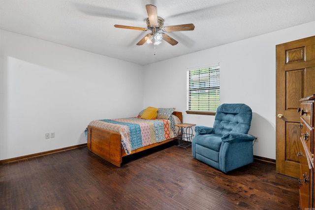 bedroom with ceiling fan and dark hardwood / wood-style flooring