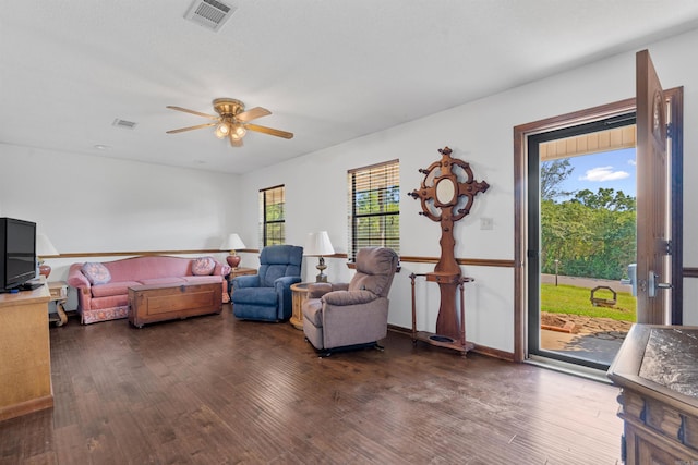 living room with hardwood / wood-style floors and ceiling fan