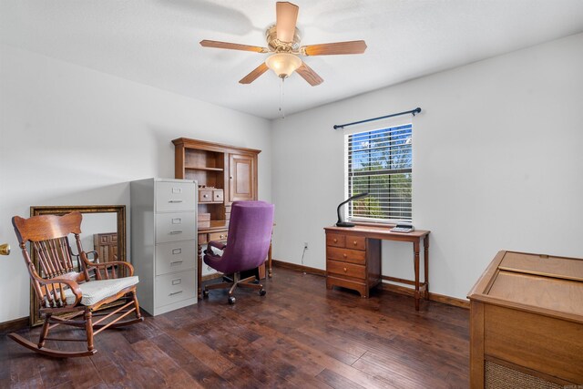 home office with dark hardwood / wood-style floors and ceiling fan