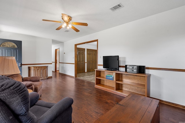 living room featuring hardwood / wood-style flooring and ceiling fan