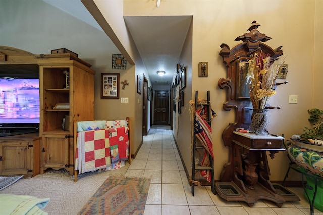 hallway with light tile patterned floors