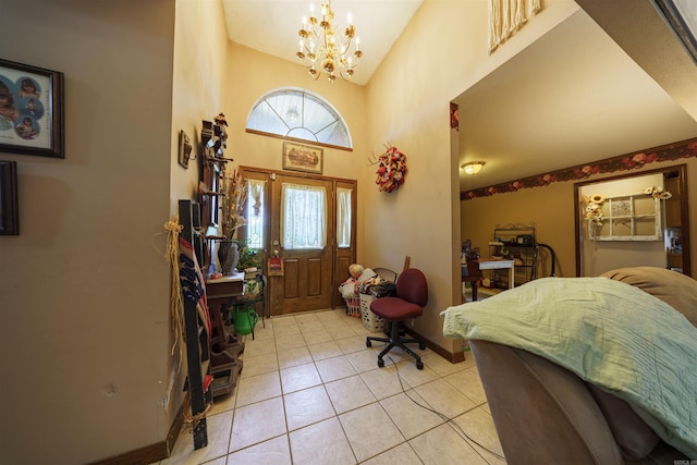 entryway with baseboards, high vaulted ceiling, a chandelier, and light tile patterned flooring