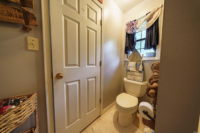 bathroom featuring toilet