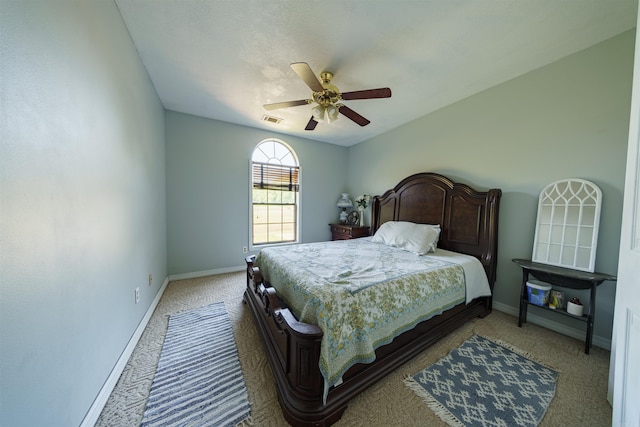 bedroom with carpet floors, baseboards, visible vents, and ceiling fan