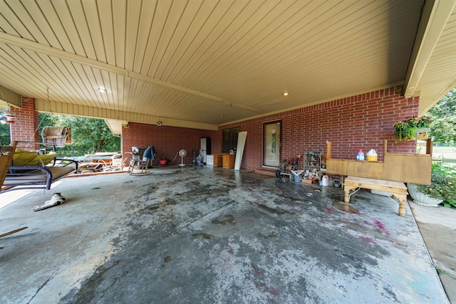 view of patio featuring an attached carport