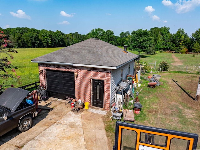 garage with concrete driveway