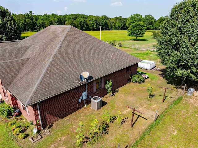 birds eye view of property with a wooded view