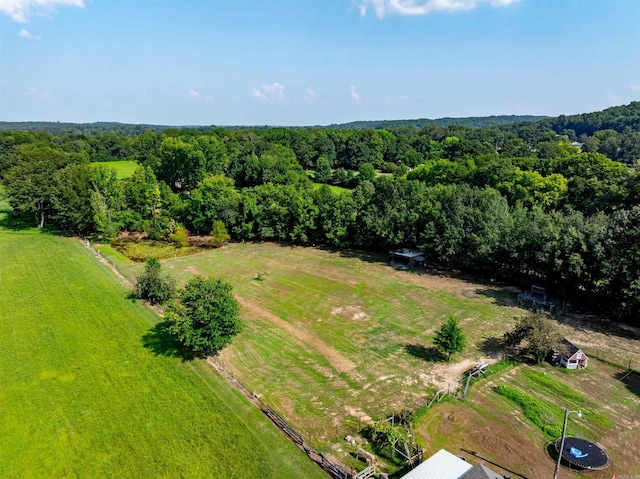 drone / aerial view featuring a wooded view and a rural view