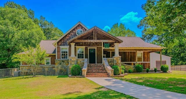 view of front of house with a garage and a front lawn