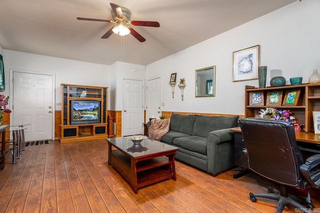 home office with wood-type flooring and ceiling fan