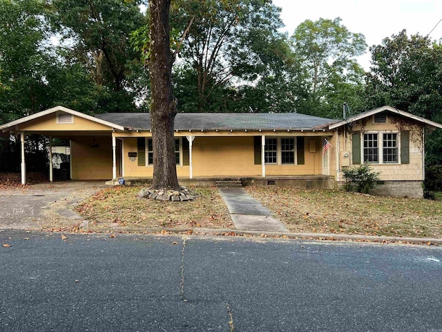 ranch-style house with a carport