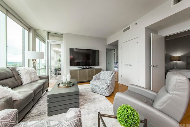 living room with light hardwood / wood-style flooring