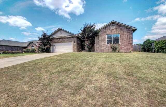 view of front facade with a garage and a front lawn