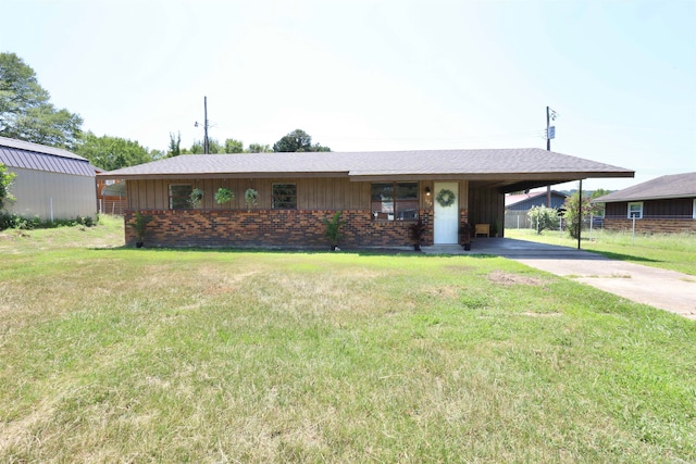 single story home with a front lawn and a carport