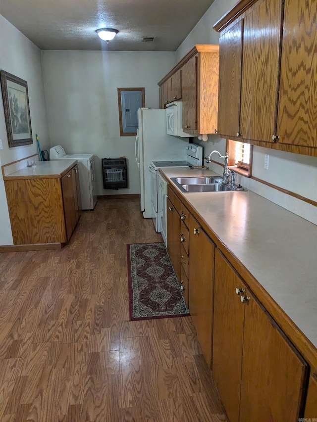 kitchen featuring independent washer and dryer, white appliances, sink, and dark wood-type flooring