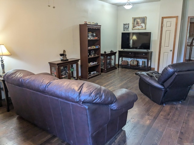 living room featuring dark wood-type flooring