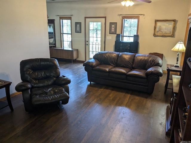 living room featuring dark hardwood / wood-style floors and ceiling fan