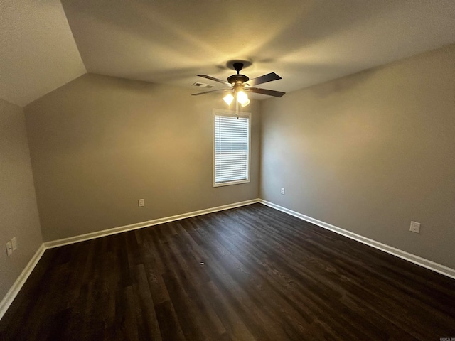 unfurnished room featuring ceiling fan, lofted ceiling, and dark hardwood / wood-style flooring