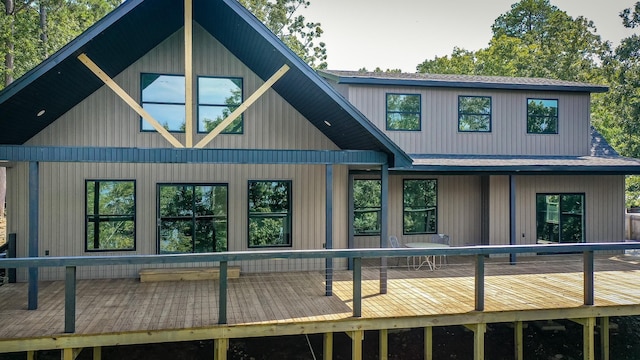 back of house featuring a deck