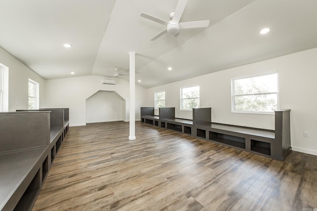 bonus room featuring lofted ceiling, hardwood / wood-style floors, and ceiling fan