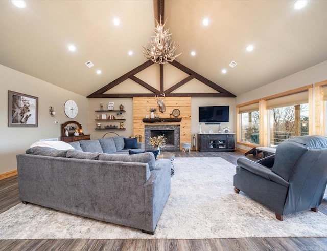 living area featuring wood finished floors, recessed lighting, a fireplace, and visible vents