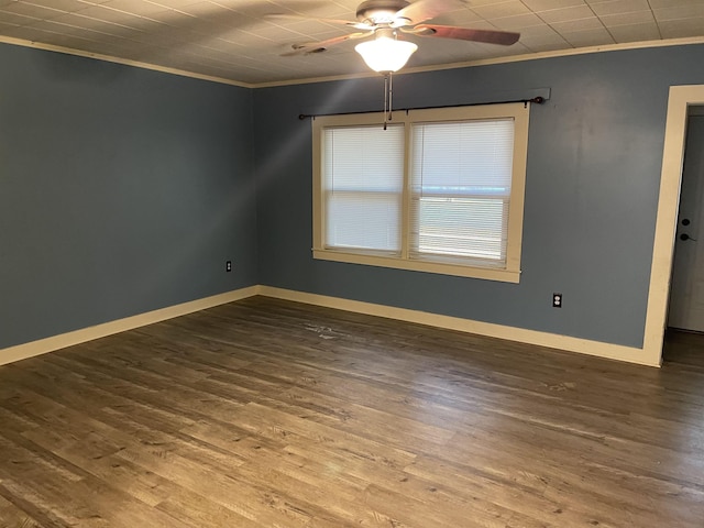 spare room featuring crown molding, wood-type flooring, and ceiling fan