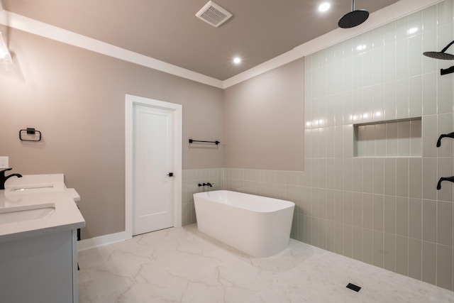 bathroom with vanity, shower with separate bathtub, ornamental molding, and tile walls