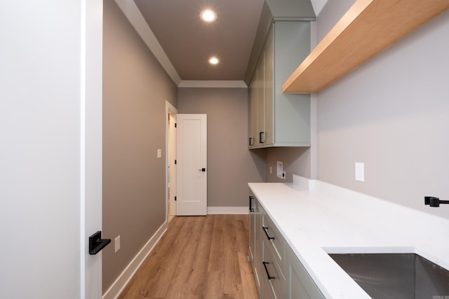 interior space featuring light hardwood / wood-style flooring, sink, and gray cabinets